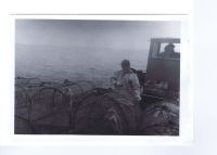 1972 – Sandy Finlayson (Priffy) and Ian MacKenzie launching creels onboard The Viking