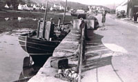Circa 1950 - MFV Castle Moil - BRD360
with Maggie MacAskill on the pavement by the barking shed