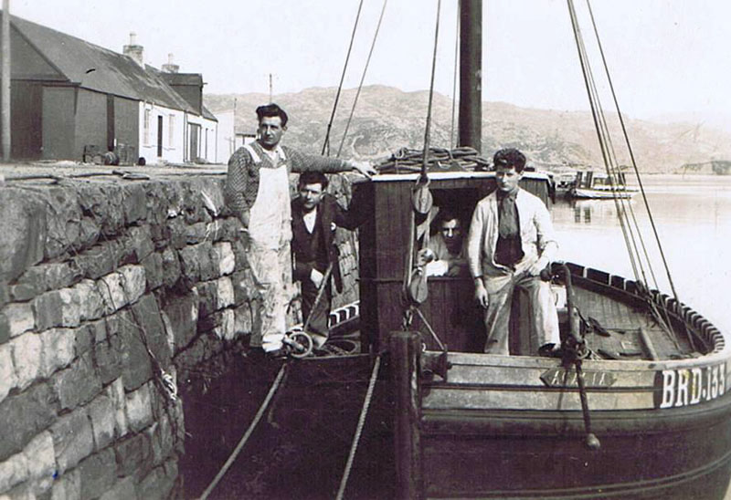 Circa 1930 - MFV Acacia - BRD133 belonging to the Reid family with an early turntable ferry at the Pier and the coal shed attached to Cameron's Shop