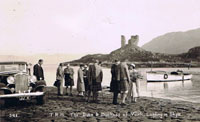 12th September 1933 - Duke and Duchess of York later to become King George VI  and Queen Elizabeth landing at Kyleakin.
King George can be seen talking to the Customs Officer and possibly Major A D MacKinnon, Dunringell.
Dr Hector MacLean the parish minister and Lord Alistair MacDonald talking to the Queen.
Also in attendance were Lady Helen Graham and Lady Hermoine Cameron, if any one knows who the other people are, please let us know.  Note the Kyle/Kyleakin ferry launch - the 