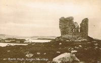 Postcard view of Castle Moil with the village and Eilean Bàn in the background.
