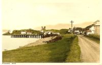 Circa 1930. The main road showing the wooden pier and the Kings Arms Hotel.
