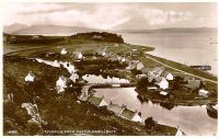 Circa late 1930's. View of village from Cnoc na Errich at high tide with "lots" in the background.
