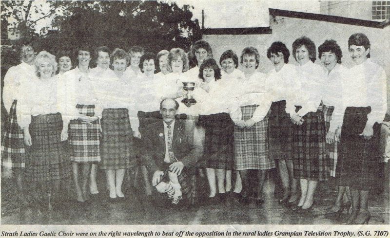 Stornoway Mod 1989 Strath Ladies Gaelic Choir with Conductor - Lachie Robertson left to right:  Pat Anderson, Ann Macrae, Catherine Grant, Karen Macrae, Cathie Reid, Moira MacPherson, Morag Ross, Margaret Healy, Mary Robertson, Annette Kerr, Connie Matheson, Isabel Fraser, Zena Campbell, Mary Reid, Anna Belle Robertson, Margaret MacQuarrie, Morag MacHattie, Morag MacLeod