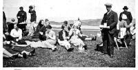 1937 - Coronation of King George VI, on the Corran outside the Kings Arms. Ladies seated left to right, from group standing by pram:  Mary Finlayson, Annie MacInnes (with hat, Hector's auntie), Agnes Cameron (Soper), Morag Robertson, Bella Robertson (with cup), Annie MacInnes (Hector Grant's mother), MacLean The Butcher (man standing with tray)