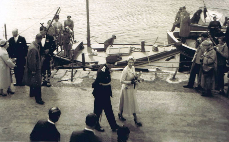 1956 - Royal Visit to Kyleakin:
Left to right:  Princess Margaret, ?, Prince Philip, Archie MacDonald (Piper), Lord MacDonald and The Queen.
Note:  On the stern of the Misty Isle, wearing a raincoat - Evander Macrae and Donald (Dollah) Reid - sitting