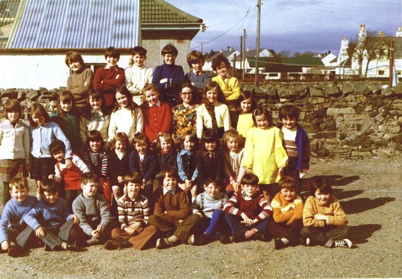 1973ish Kyleakin Old School:
Back row, left to right:  Michael Taylor, Jonathan Macrae, Donnie Ross, Hamish Graham, James Urquhart, Neil Robertson
Third row, left to right:  Fiona MacKay, Helen Graham, Elspeth Campbell, Fiona MacDiarmid, Morag MacLeod, Christine Morrison, Margaret Robertson, Ellen Robertson and Janette Ross
Second row left to right:  Ann Ross, Michelle Branson, Jacqualine (Jackie) Cameron, Christine Reid, Heather Campbell, Helen MacIntosh, Wendy Cornish, Catriona MacAskill, Maureen Robertson and Margaret Taylor
Front row sitting left to right:  Angus MacLennan, Donald MacLennan, Norman Ross, Andrew Webley, Ronald Reid, Cameron Reid, Angus Macrae, Evander Macrae and Roderick Macrae