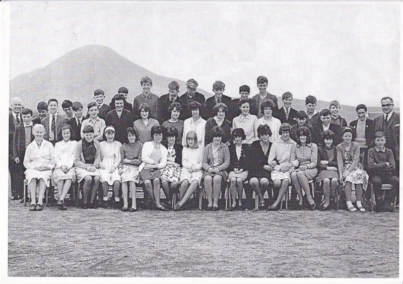 Broadford Junior Secondary School - Circa 1966
Back row: John MacSween (Headmaster), Norrie Robertson(S), Ian MacLean, Duncan MacDonald (W), Angus Morrison, Donald Neil MacInnes (T), Neil ? (Bonkers) (S), Alistair MacIntyre (Breadalbane), John Robertson,  Billy Fairfowl (S), Donald John MacInnes (S), Neil MacLure (S), Charlie MacKinnon (Brd), John Angus MacLeod, Hamish Fraser (B), John MacKinnon (Teacher)
Middle Row: Peter MacPherson (S), Ian Charles MacKinnon (Brd), Calum MacLeod (B), Alan Fraser (Brd), Elizabeth MacKinnon (E), Joan MacPherson (S), Donna MacKinnon (H), Isobel Nicolson, Euphemia Robertson (Brd), Wilma Anderson (B), Catriona MacInnes (Brd), Norman MacInnes (S), Archie MacPherson (S)
Front row: Mrs MacLean (Teacher), Elizabeth Graham, Mary Ann Lamont (Brd), Ann Macrae (Brd), Margaret Anderson (B), Morag Branson, Catherine Macrae (Brd), Hannah Smith (Brd), Kathleen MacPherson (B), Catriona MacKinnon, Kate MacKinnon (L), Grace Brown (S), Kennac MacKinnon, (Brd), Isobel Kennedy (S), Rena Robertson, Donald John Morrison

Key: S = Sleat, W = Waterloo, T = Torrin, Brd = Broadford, B = Breakish, E = Elgol, H = Heaste, L = Luib, remainder all Kyleakin.